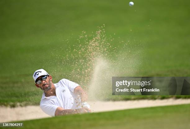 Pablo Larrazabal of Spain plays his bunker shot on the fourth hole during Day Three of the Commercial Bank Qatar Masters at Doha Golf Club on March...