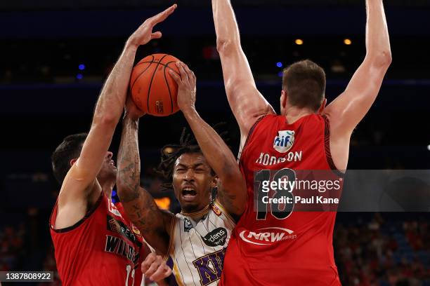 Jaylen Adams of the Kings goes to the basket against Todd Blanchfield and Matthew Hodgson of the Wildcats during the round 17 NBL match between the...