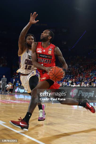 Victor Law of the Wildcats drives to the basket against Jarell Martin of the Kings during the round 17 NBL match between the Perth Wildcats and...