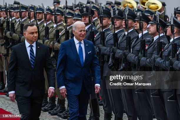 Poland's President, Andrzej Duda and US. President Joe Biden inspects the Polish guard at the presidential Palace on March 26, 2022 in Warsaw,...