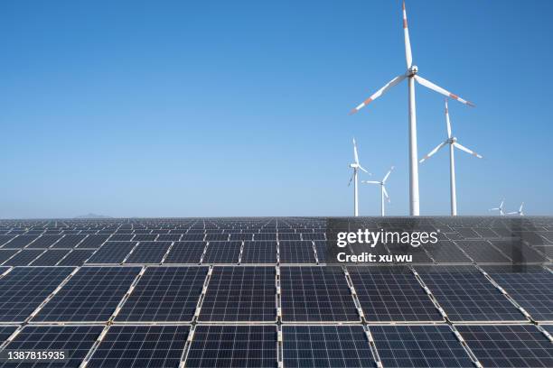 energy industry solar power before wind power - wind farms stockfoto's en -beelden