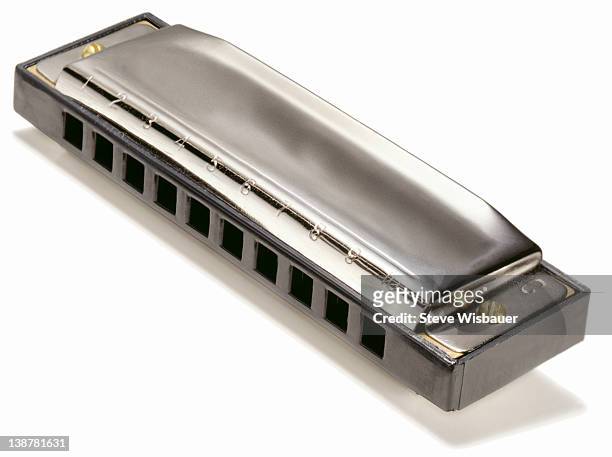a chrome professional harmonica - harmonica stock pictures, royalty-free photos & images