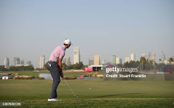 Wilco Nienhaber of South Africa plays his approach shot on the 18h hole during Day Three of the Commercial Bank Qatar Masters at Doha Golf Club on...