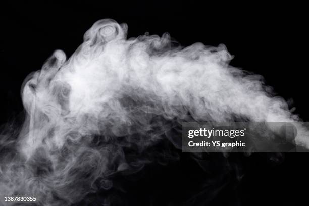 humidifier vapor photographed against a black background - 煙 ストックフォトと画像