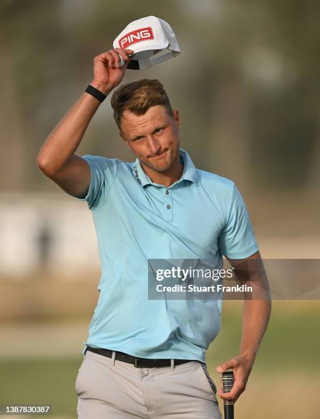 Adrian Meronk of Poland celebrates his birdie on the 18th hole during Day Three of the Commercial Bank Qatar Masters at Doha Golf Club on March 26,...