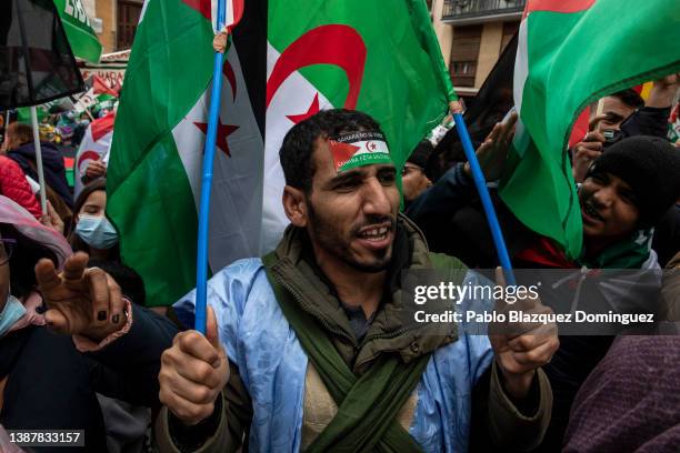 Members of the Sahrawi community and their supporters shout slogans during a protest outside the Minister of Foreign Affairs on March 26, 2022 in...