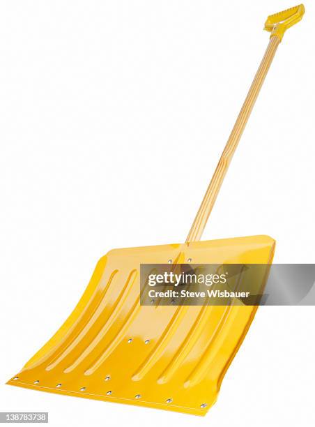 a bright yellow snow shovel - snow shovel 個照片及圖片檔