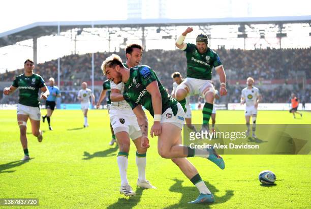 Ollie Hassell-Collins of London Irish celebrates after scoring his sides first try during the Gallagher Premiership Rugby match between London Irish...