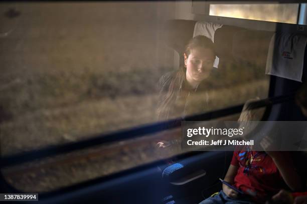 Refugee Vlada and her son Bogdan from Mariupol fleeing war torn Ukraine take a train from Przemysl to Szczecin on route to Dabrowan Gornicza March...