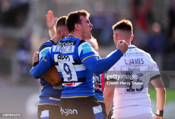 Ben Spencer of Bath Rugby celebrates their sides third try scored by team mate Tom de Glanville during the Gallagher Premiership Rugby match between...