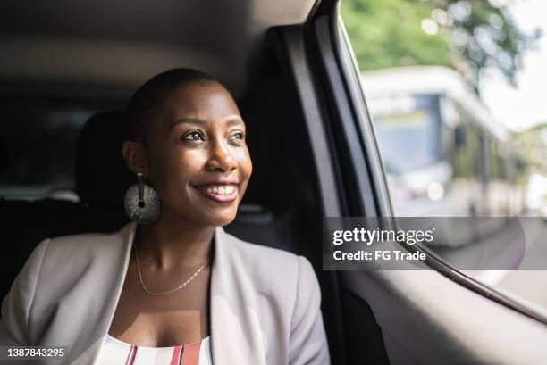 contemplative adult woman in a car - inner courage stock pictures, royalty-free photos & images