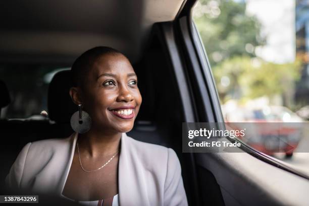 contemplative adult woman in a car - inner courage stock pictures, royalty-free photos & images