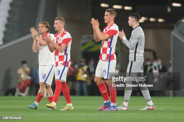 Croatia players applaud their fans after the international friendly match between Croatia and Slovenia at Education City Stadium on March 26, 2022 in...