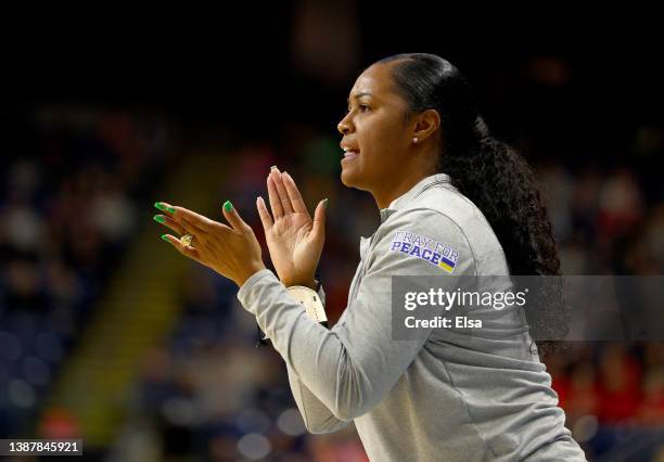 Head coach Niele Ivey of the Notre Dame Fighting Irish directs her players in the first half against the NC State Wolfpack during the Sweet Sixteen...