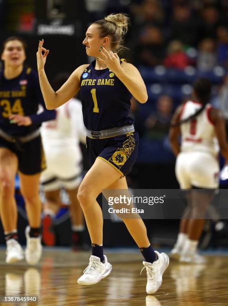 Dara Mabrey of the Notre Dame Fighting Irish celebrates her three point shot in the first half against the NC State Wolfpack during the Sweet Sixteen...