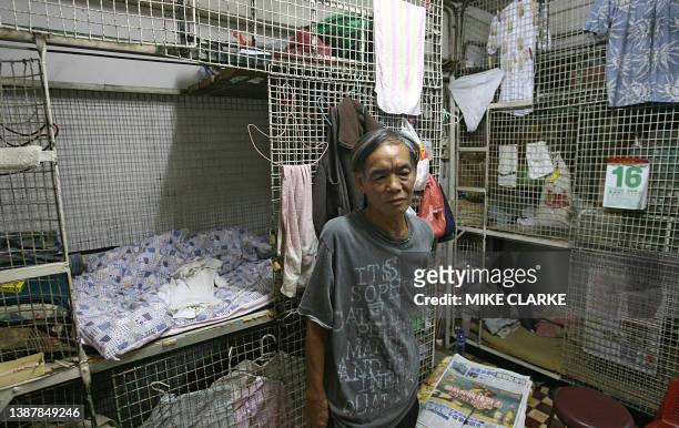 Hongkong-handover-10years-economy This picture taken 14 May, 2007 shows Kong Siu-kan in a "cage dwelling", in one of the world's most densely...