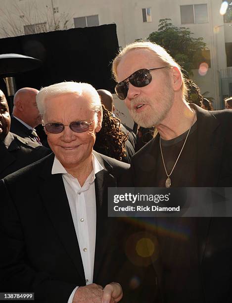 Honorees George Jones and Gregg Allman chat during The 54th Annual GRAMMY Awards - Special Merit Awards Ceremony And Nominee Reception at The...