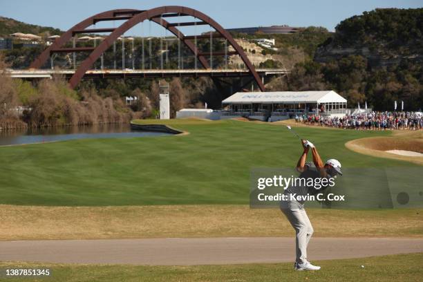 Dustin Johnson of the United States plays a shot on the 12th hole in his Round of 16 match against Richard Bland of England on the fourth day of the...