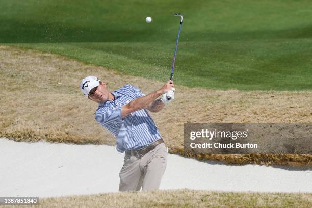 Kevin Kisner of the United States chips in for eagle from a bunker on the 16th hole in his Round of 16 match against Adam Scott of Australia on the...