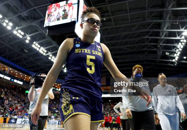 Olivia Miles of the Notre Dame Fighting Irish walks off the court after the loss to the NC State Wolfpack during the Sweet Sixteen round of the NCAA...