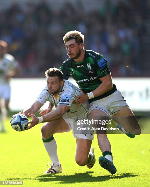 Dan Biggar of Northampton Saints and Ollie Hassell-Collins of London Irish compete for the ball during the Gallagher Premiership Rugby match between...