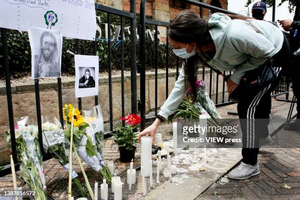 Fan of U.S. Band Foo Fighters places a candle in front the hotel where the band's drummer Taylor Hawkins died, on March 26, 2022 in Bogota, Colombia....