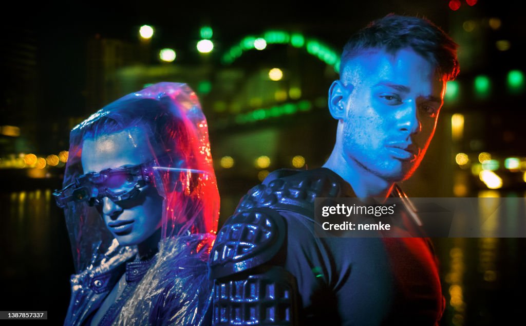 Metaverse man and woman in futuristic neon city
