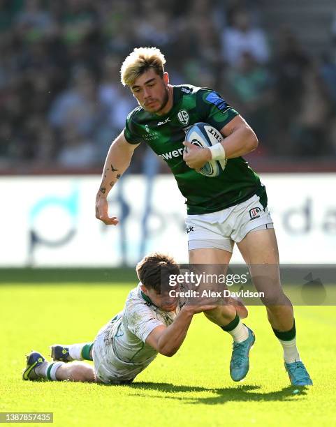 Ollie Hassell-Collins of London Irish breaks past George Furbank of Northampton Saints during the Gallagher Premiership Rugby match between London...