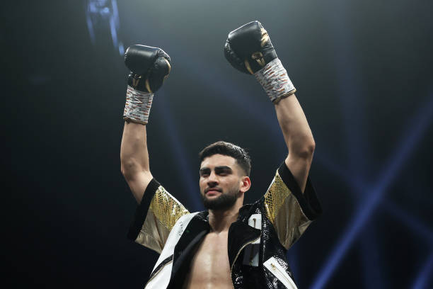 Hassan Azim celebrates after victory in the Welterweight fight between Hassan Azim and Yoncho Markov at Wembley Arena on March 26, 2022 in London,...