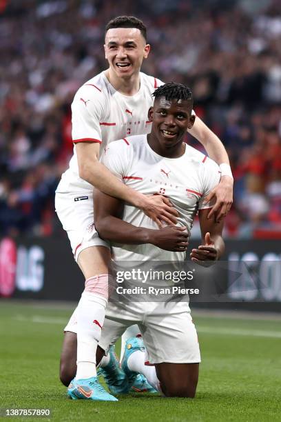 Breel Embolo celebrates with Ruben Vargas of Switzerland after scoring their team's first goal during the International Friendly match between...