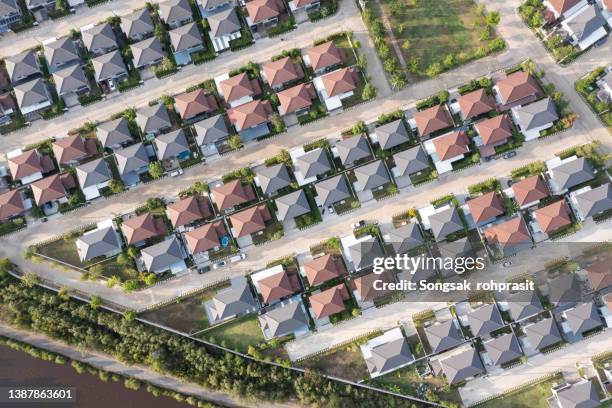 suburban life has grown and our homes have gotten closer and closer. each house driveway leading to another life. - house auction stockfoto's en -beelden