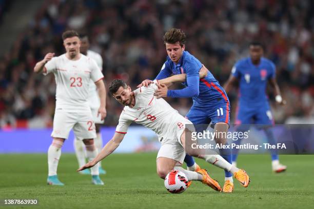 Remo Freuler of Switzerland is challenged by Mason Mount of England during the International Friendly match between England and Switzerland at...