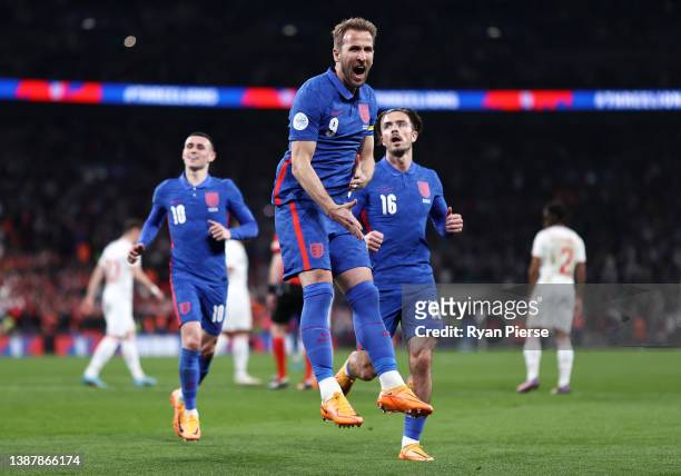 Harry Kane of England celebrates after scoring their team's second goal from the penalty spot during the International Friendly match between England...