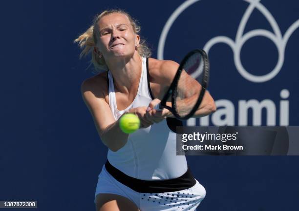 Katerina Siniakova of Czechia returns a shot to Daria Saville of Russia during the 2022 Miami Open presented by Itaú at Hard Rock Stadium on March...