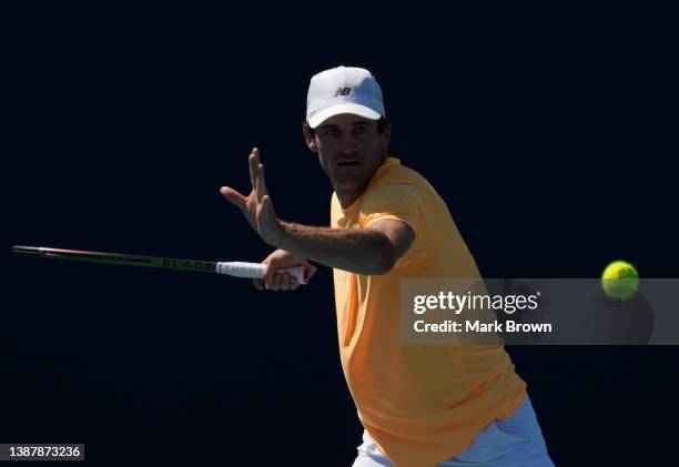 Tommy Paul of United States returns a shot to Karen Khachanov of Russia during the 2022 Miami Open presented by Itaú at Hard Rock Stadium on March...