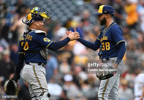 William Contreras celebrates with Devin Williams of the Milwaukee Brewers after a 6-3 win over the Pittsburgh Pirates at PNC Park on July 2, 2023 in...