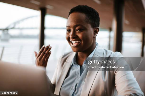 businesswoman making an online meeting on her laptop - 20 the exhibition stock pictures, royalty-free photos & images