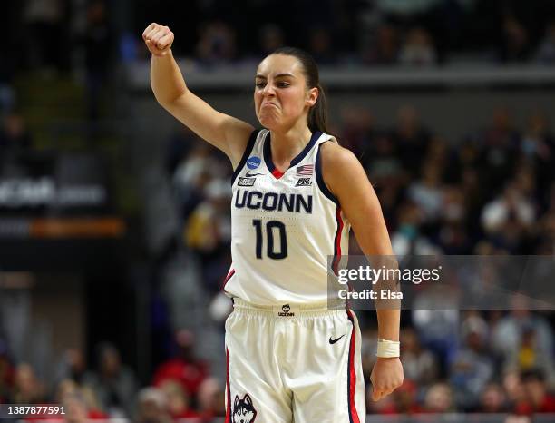 Nika Muhl of the UConn Huskies reacts after a three point shot in the first half against the Indiana Hoosiers during the Sweet Sixteen round of the...