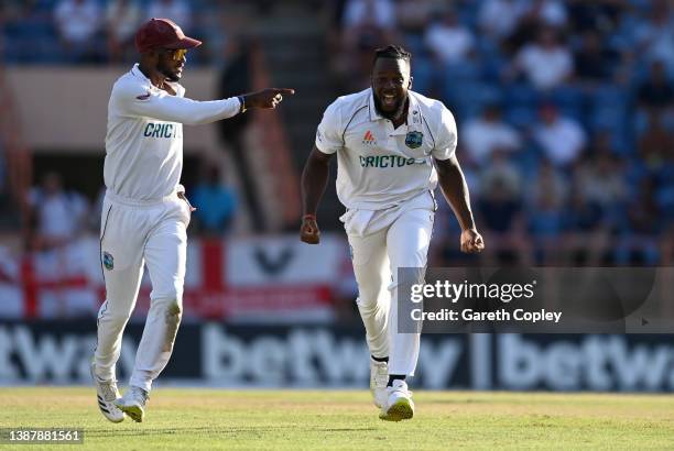 Kyle Mayers of the West Indies celebrates with captain Kraigg Brathwaite after dismissing Craig Overton of England during day three of the 3rd Test...