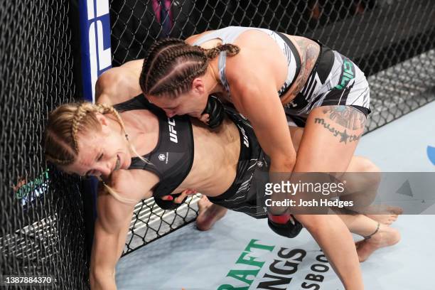 Jennifer Maia of Brazil takes down Manon Fiorot of France in a flyweight fight during the UFC Fight Night event at Nationwide Arena on March 26, 2022...