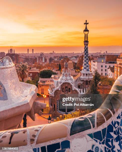 view of the city from park guell in barcelona, spain. - barcellona stock-fotos und bilder