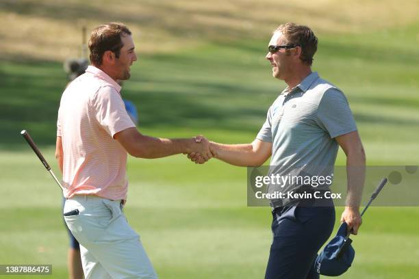 Scottie Scheffler of the United States shakes hands with Seamus Power of Ireland on the 16th hole after defeating him 3&2 in their quarterfinal match...