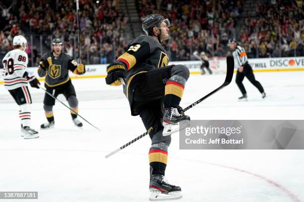 Evgenii Dadonov of the Vegas Golden Knights scores the game winning goal in overtime against the Chicago Blackhawks at T-Mobile Arena on March 26,...