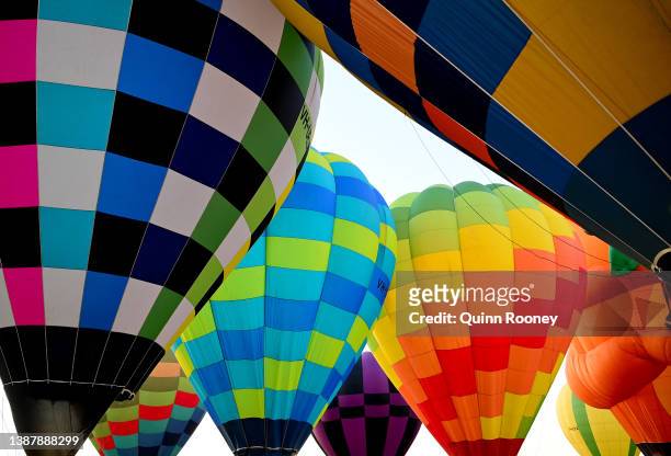 Hot Air Balloons prepare to take flight from Brown Brothers Milawa Airfield on March 27, 2022 in Wangaratta, Australia. The King Valley Balloon...