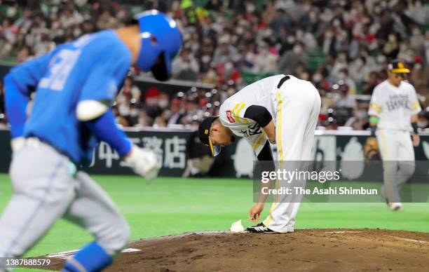 Kodai Senga of the Fukuoka SoftBank Hawks reacts after allowing a solo home run to Kazunari Ishii of the Hokkaido Nippon-Ham Fighters in the 4th...