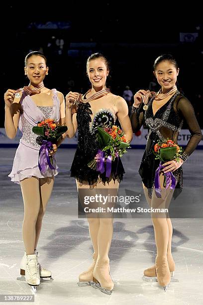 Mao Asada of Japan, Ashley Wagner and Caroline Zhang pose for photographers after the Ladies Competition during the ISU Four Continents Figure...