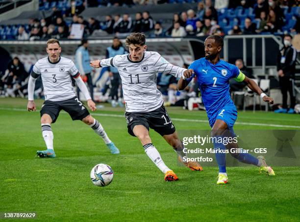 Kai Havertz of Germany in action with Dean David of Israel during the international friendly match between Germany and Israel at PreZero-Arena on...