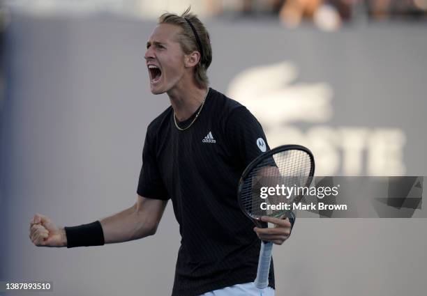 Sebastian Korda of United States celebrates after defeating Albert Ramos-Vinolas of Spain in three sets during the 2022 Miami Open presented by Itaú...