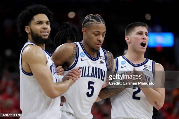Justin Moore of the Villanova Wildcats is helped off the court after an injury during the second half of the game against the Houston Cougars in the...