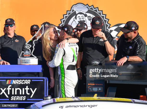 Allmendinger, driver of the Nutrien Ag Solutions Chevrolet, is congratulated by his wife, Tara Allmendinger in victory lane after winning the NASCAR...